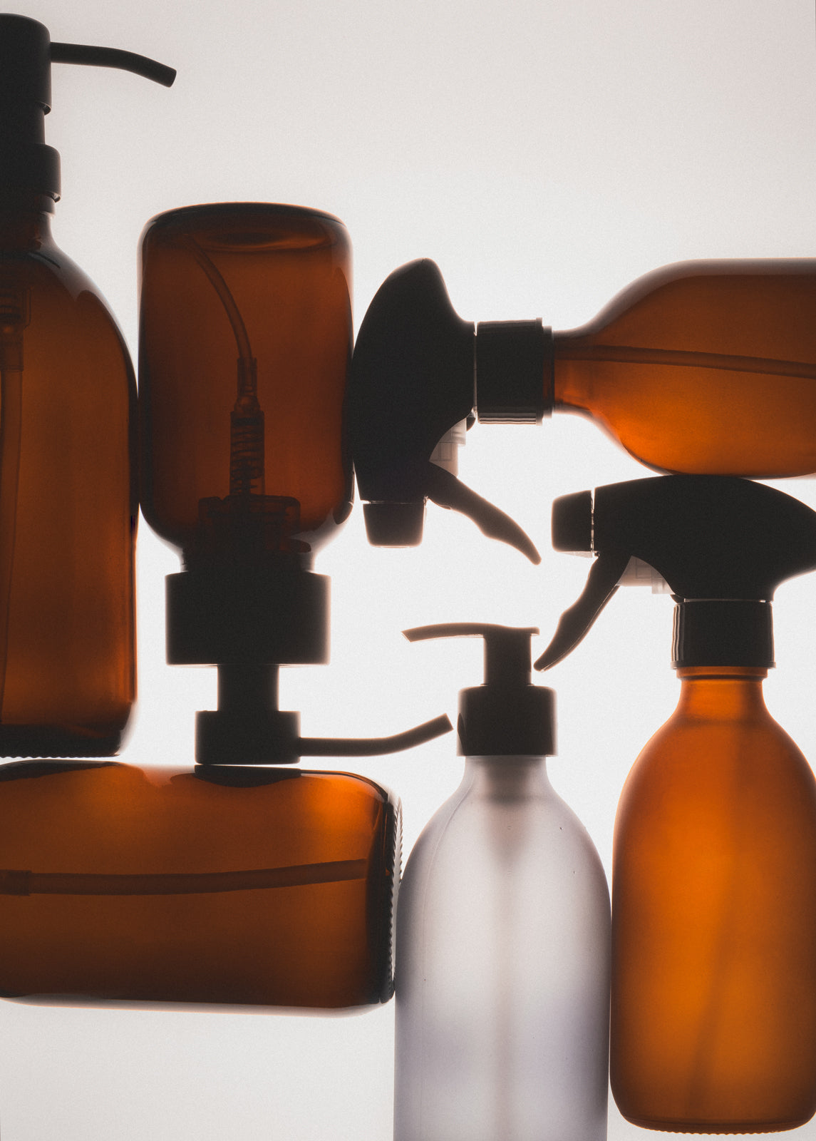 Grey Kuishi soap dispenser from the Mixed Amber Glass Collection, featuring a sleek pump design for liquid soap.