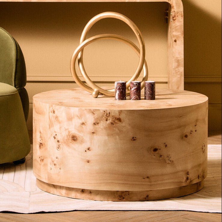 Natural burl wood round coffee table with drum shape design by Orsina, showcasing smooth wood grain and modern style.