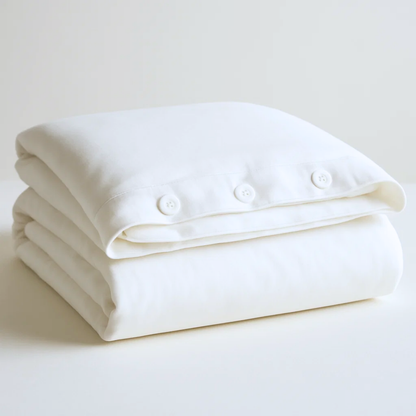 Organic Cotton Percale Bed Sheets by Ethical Bedding™, featuring a neatly made duvet cover and matching pillowcases.
