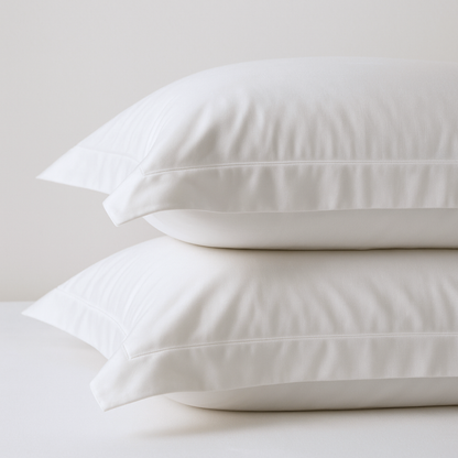 Organic cotton percale bed sheet set pillowcases from Ethical Bedding™ with smooth, crisp white fabric and simple design.