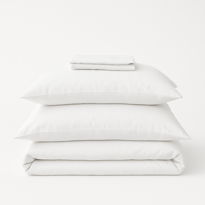 Organic cotton percale bed sheet set from Ethical Bedding™ with neatly folded, soft, white bed sheets and matching pillowcases.