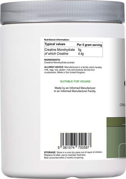 Vitadefence® Creatine Monohydrate powder in a 500g round silver container, side view showing the unflavored dietary supplement.