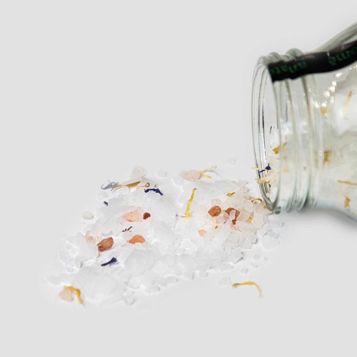 anatomē Relax + Sleep chamomile bath salts in a jar, showcasing soothing body care with chamomile flowers and salt crystals