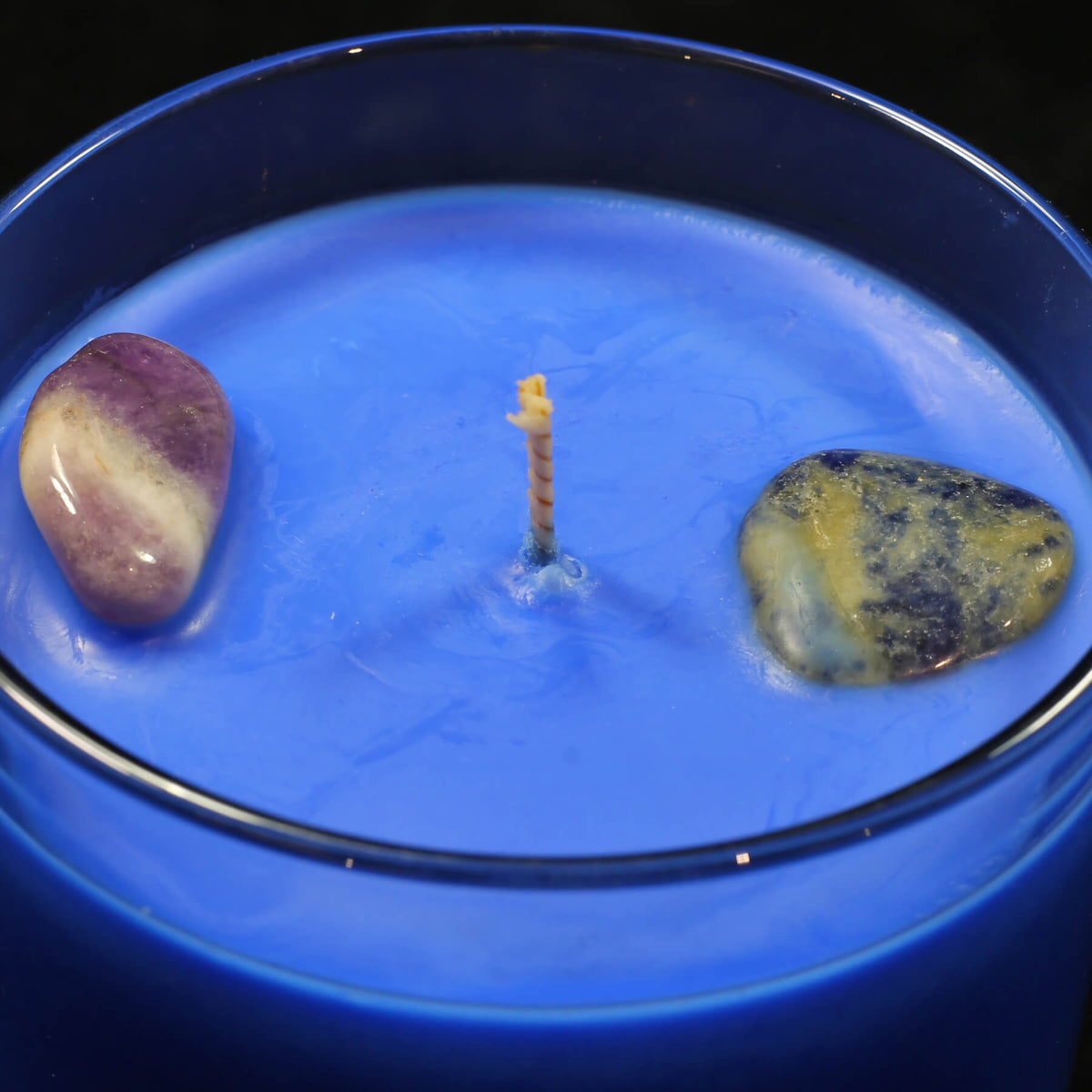 Relax crystal-infused scented candle by The Psychic Tree, showing a calming candle with crystals and soft glow in a minimalist setting.