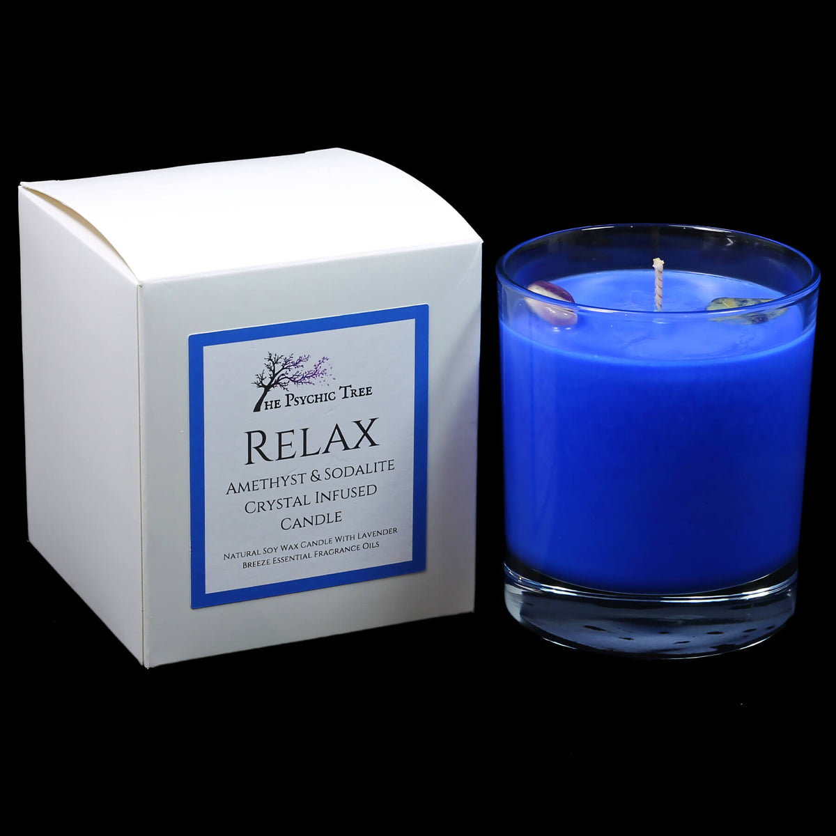A crystal-infused scented candle labeled "Relax" by The Psychic Tree, featuring a glass jar and calming decorative elements.