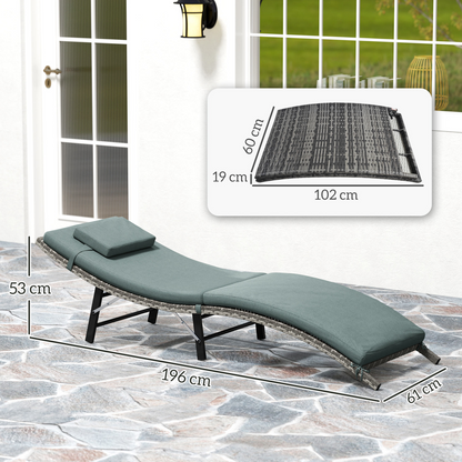 Outsunny folding rattan sun lounger with cushioned seat and pillow, ideal for garden relaxation and outdoor lounging.