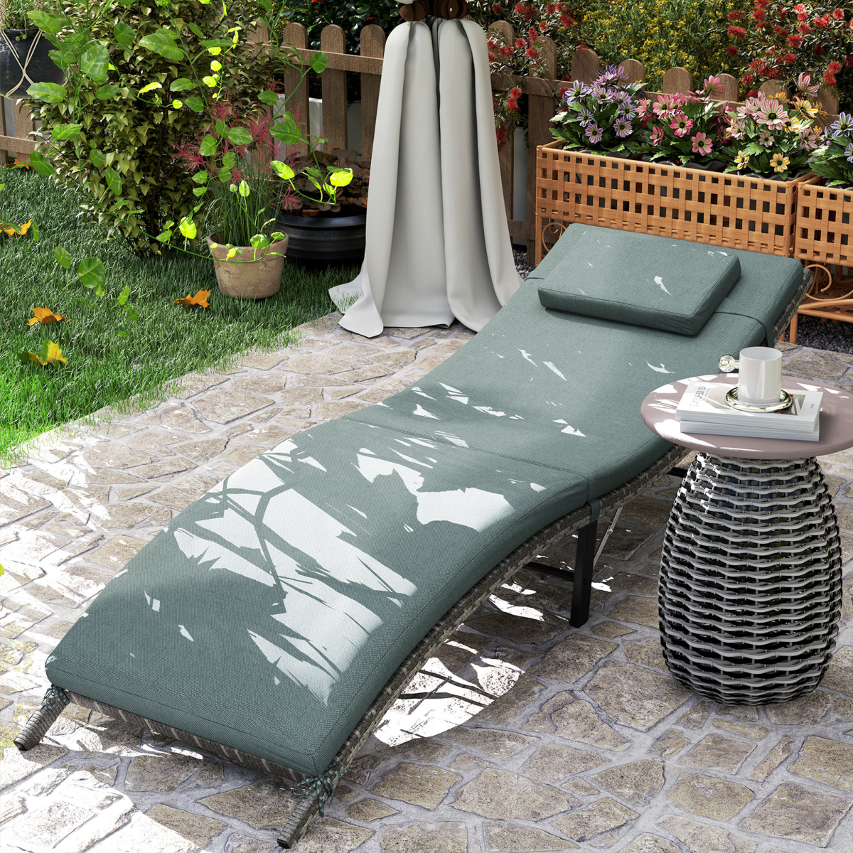 Outsunny folding rattan sun lounger with cushion and pillow, ideal for garden relaxation and outdoor lounging.