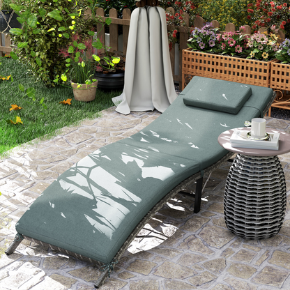 Outsunny folding rattan sun lounger with cushion and pillow, ideal for garden relaxation and outdoor lounging.