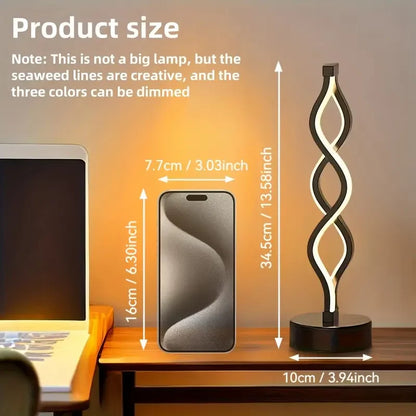 DArtano Modern Twist LED table lamp as a dimmable night light with soft ambient glow on a bedside table.