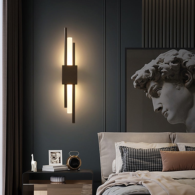 Modern black and gold LED wall lamp by Light My House with warm light, hard-wired design, ideal for contemporary interiors.
