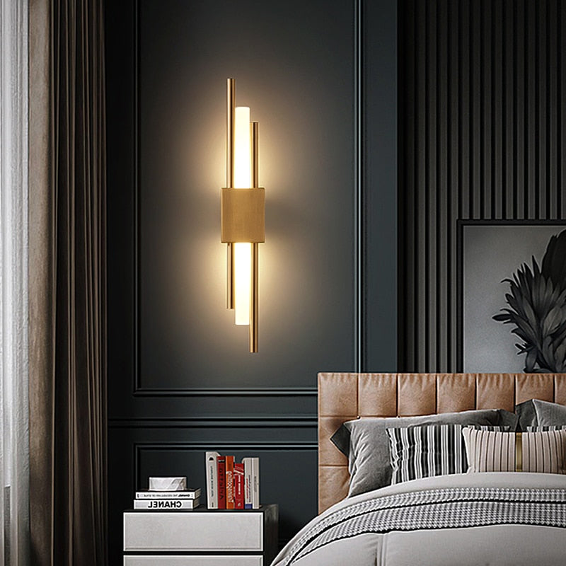 Modern black and gold LED wall lamp by Light My House with warm light, hard-wired design, suitable for contemporary interiors.