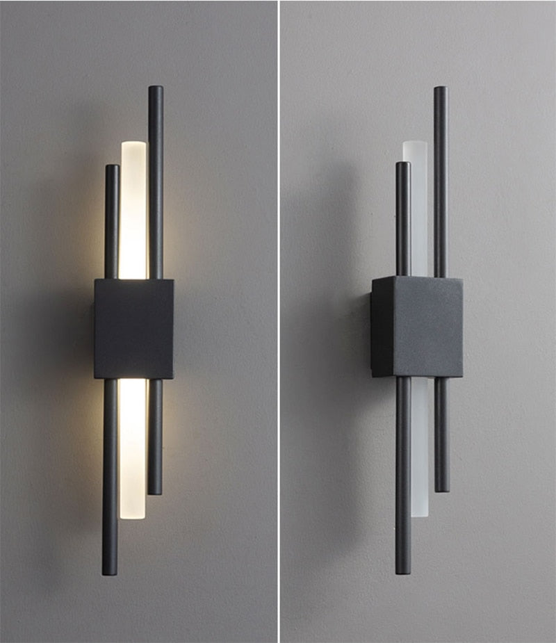 Modern black and gold Emporium LED wall lamp by Light My House, featuring warm light and a sleek, hard-wired design.