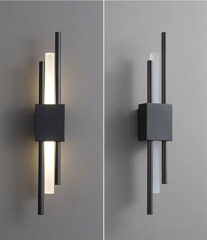 Modern black and gold Emporium LED wall lamp by Light My House, featuring warm light and a sleek, hard-wired design.