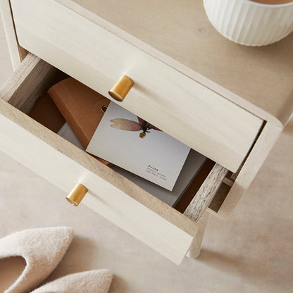 Minimalist white mango wood Logan bedside table by Fishe and Lilly, featuring a narrow design and clean Scandinavian style.