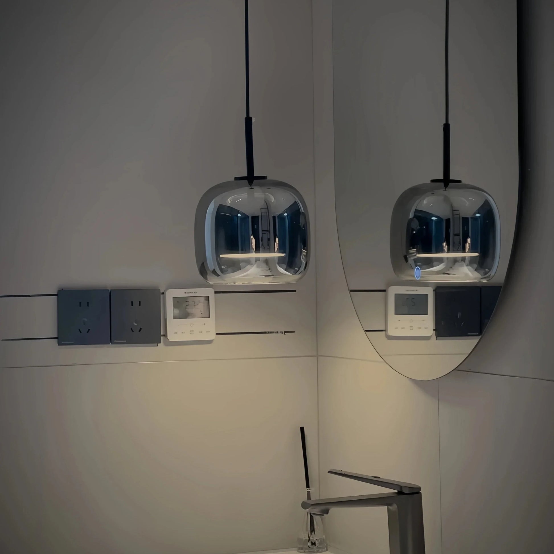 Black and gold pendant lamp with LED warm light and adjustable height, designed for modern interior lighting.