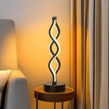 Modern Twist LED table lamp by DArtano, dimmable night light with ambient glow, showcasing sleek design and soft illumination.