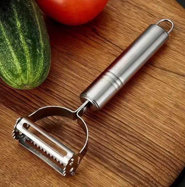 DEPOT multi-functional vegetable peeler with ergonomic handle and sharp blades for peeling fruits and vegetables efficiently.