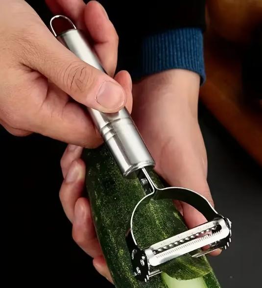 DEPOT multi-functional vegetable peeler with ergonomic handle and stainless steel blade for efficient peeling.