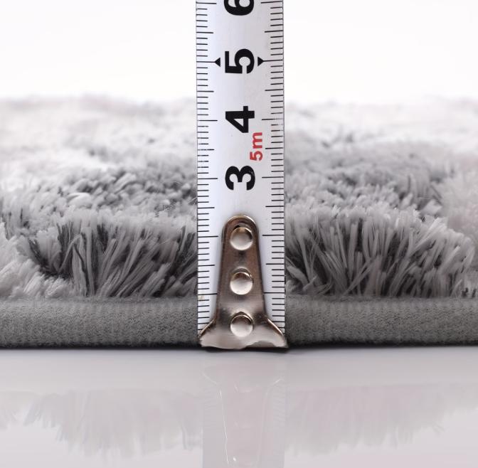 Two plush chenille bathroom rugs from DEPOT, ultra-soft and highly absorbent, shown in a cozy bathroom setting.