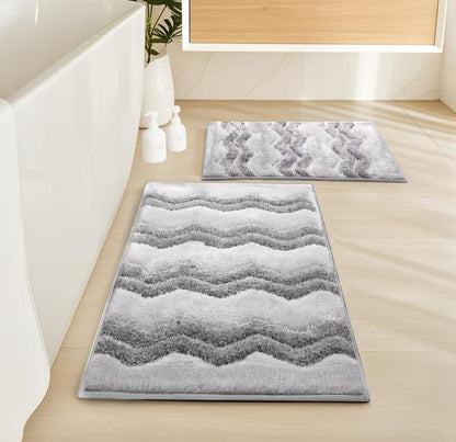 Two luxury chenille bathroom rugs from DEPOT, ultra-soft and highly absorbent, shown in a cozy bathroom setting.