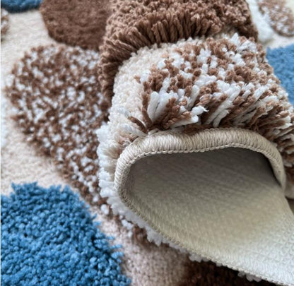 Pebble-style plush non-slip bathroom mat with rubber backing, soft and machine washable bath rug by DEPOT.