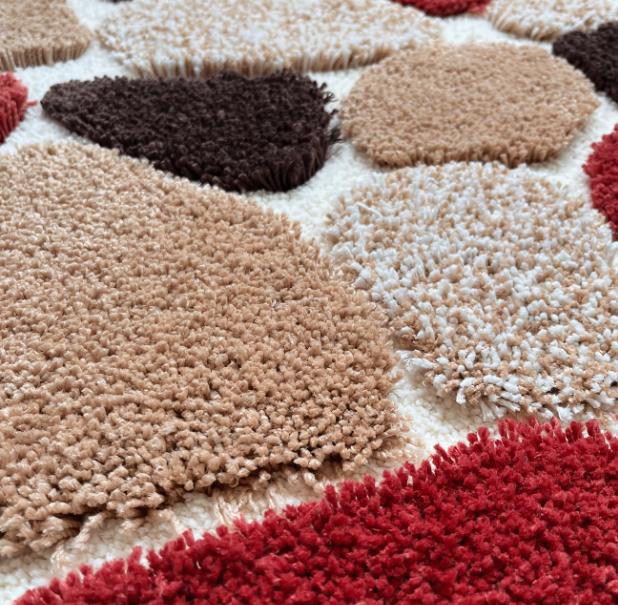 Pebble-style plush non-slip bath mat with rubber backing, soft, machine washable bathroom rug by DEPOT.