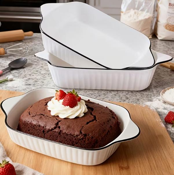 Three ceramic baking dishes from DEPOT 3-piece set, square and rectangular shapes, with a smooth, glazed finish for oven baking.