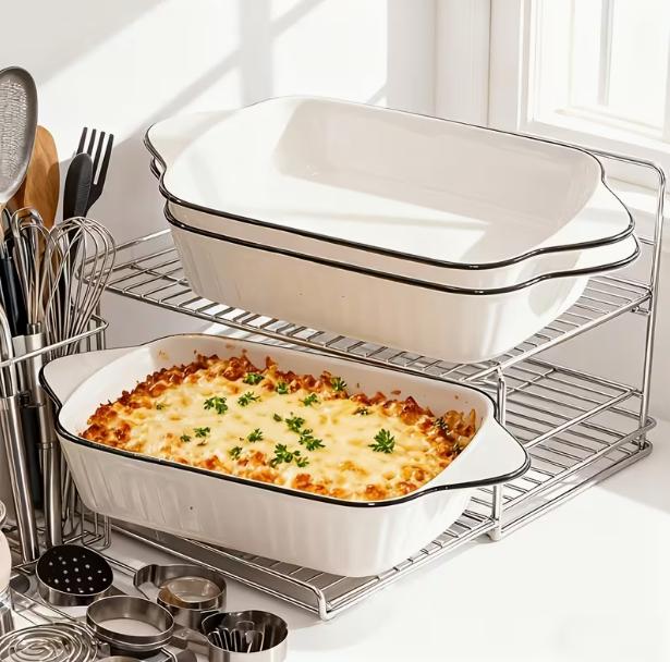 Set of three DEPOT ceramic baking dishes with handles, versatile for oven use and meal prep.