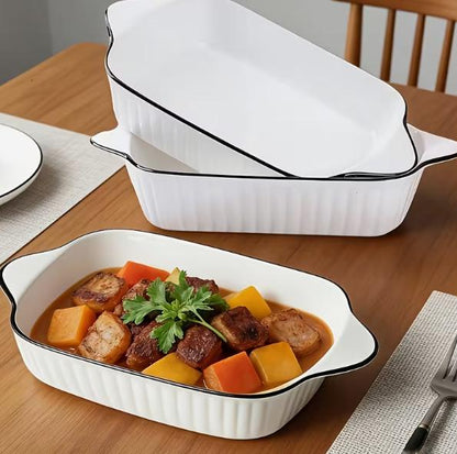 Set of three ceramic baking dishes by DEPOT, rectangular and round shapes for oven baking and serving.