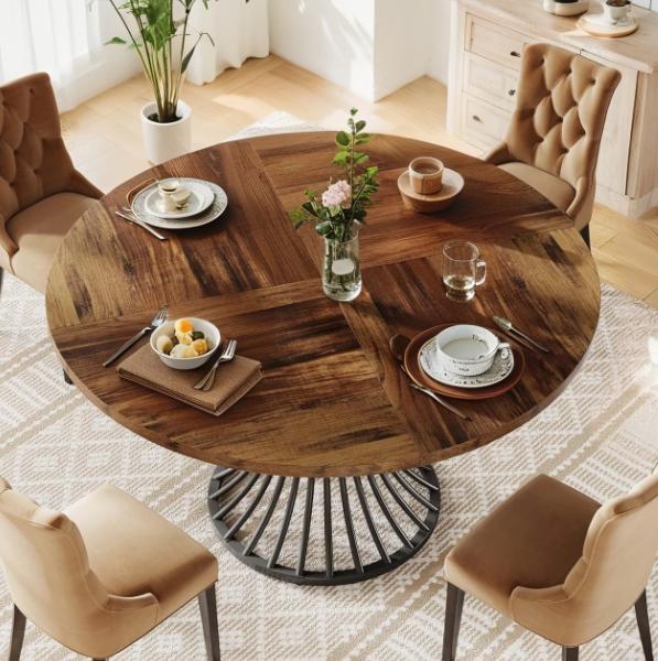 Round farmhouse dining table with a 47-inch wooden top and an elegant metal base, ideal for dining and living room setups.