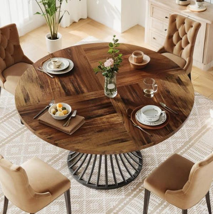 Round farmhouse dining table with a 47-inch wooden top and an elegant metal base, ideal for dining and living room setups.