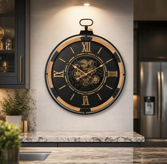 Industrial extra large wall clock by Maravi featuring a black and gold cog design with bold, vintage-style clock hands.