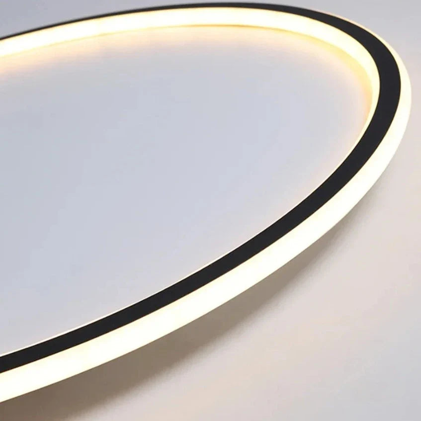 Black and white LED ring flush mount chandelier by Light My House, dimmable ceiling light with sleek modern design.