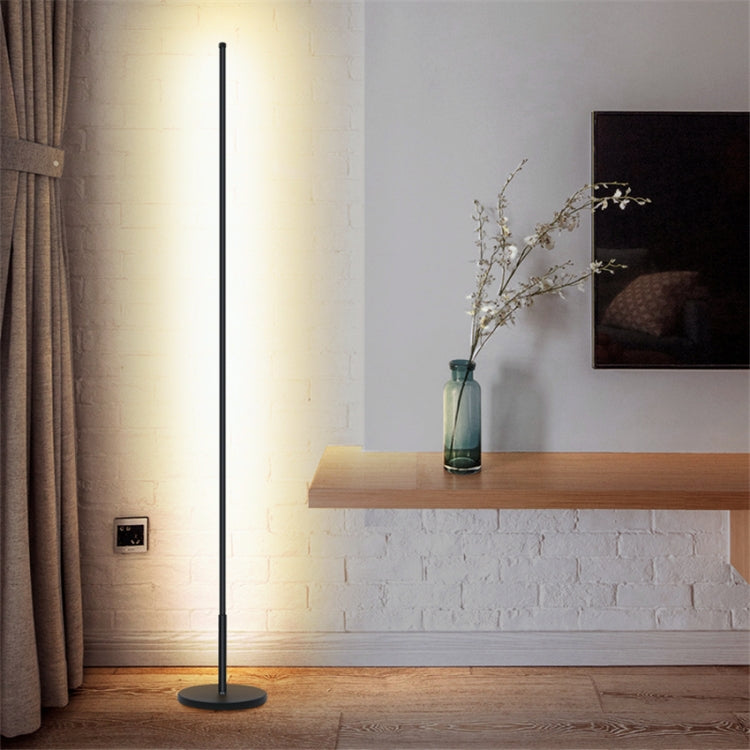 Mira Sales LED floor lamp with warm and white light, stepless dimming, minimalist design for bedroom or living room ambiance.