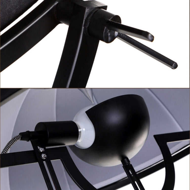 Industrial-style Satellite Studio Tripod Floor Lamp by Mira Sales, standing with adjustable spotlight and tripod base for modern home lighting.