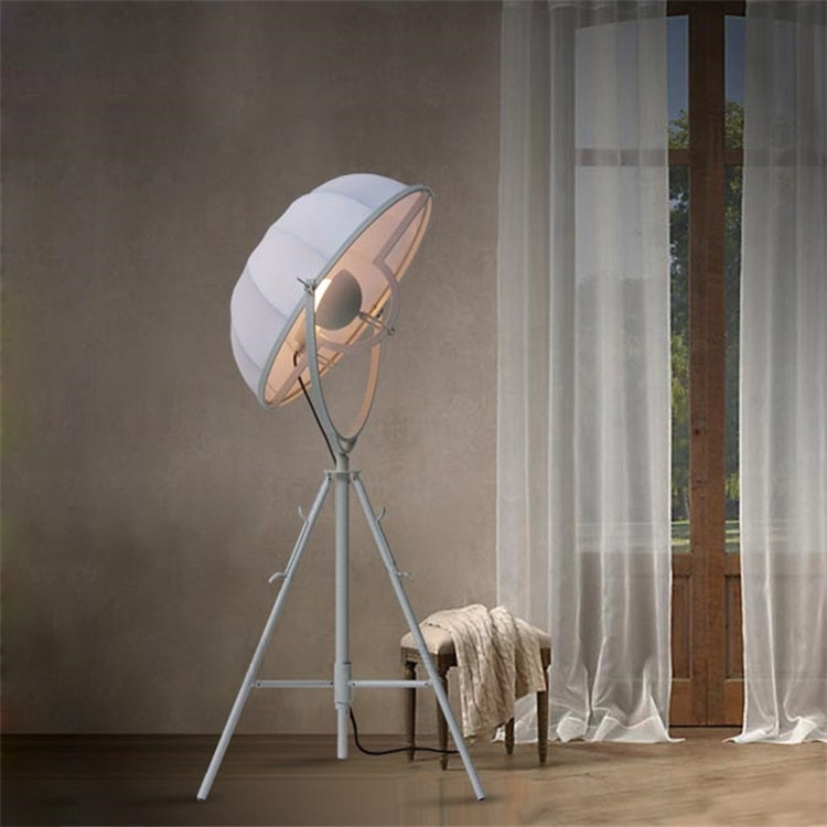 Industrial-style Satellite Studio Tripod Floor Lamp by Mira Sales with adjustable spotlight and sturdy standing base for home lighting.