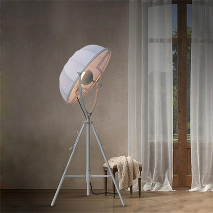 Industrial-style Satellite Studio Tripod Floor Lamp by Mira Sales with adjustable spotlight and sturdy standing base for home lighting.
