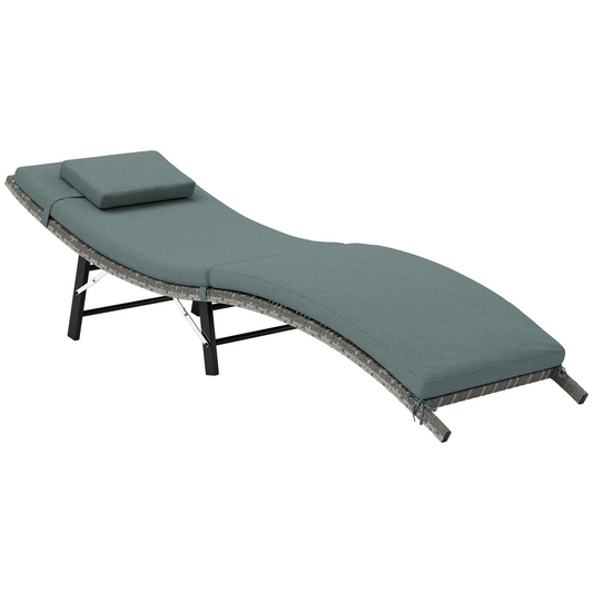 Outsunny folding rattan sun lounger with cushion and pillow, outdoor garden furniture for relaxing in the sun.