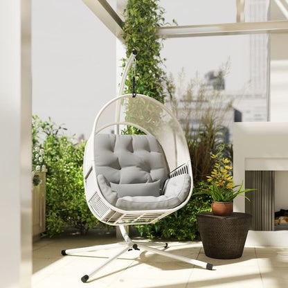 Outsunny hanging egg chair with stand, cushioned for garden relaxation, featuring a cozy seat and sturdy metal frame.
