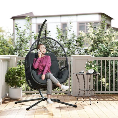 Outsunny hanging egg chair with stand and cushions, suitable for garden relaxation and outdoor seating.