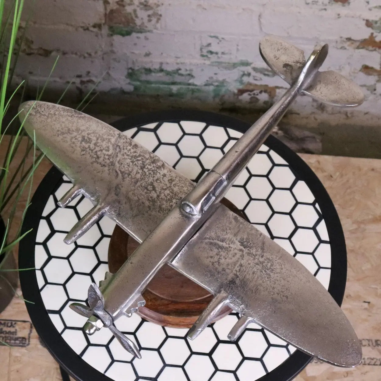 Vintage Spitfire model ornament by Maravi featuring metal airplane on a wooden base, detailed and collectible aircraft display piece.