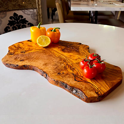 OliveArt handcrafted large olive wood rustic charcuterie board with an irregular shape, ideal for serving cheeses and appetizers.