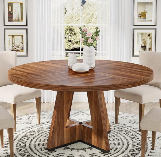 Wooden round dining table by DEPOT, ideal for kitchen, dining room, living space, or office use with a smooth wooden surface.