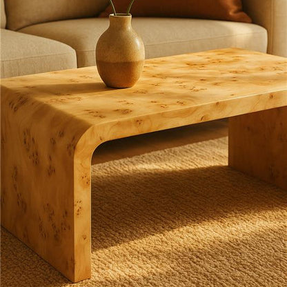 Natural Burl wood curved coffee table by Orsina with smooth, flowing edges, showcasing its rich grain and sleek design.