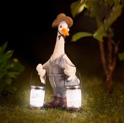 Solar duck garden ornament with LED lantern by Marco Paul, outdoor statue featuring a charming duck design and glowing light.