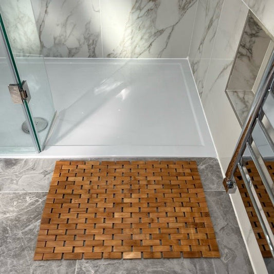 Eco Bath London bamboo bath mat rolled up, waterproof, anti-slip shower mat for bathroom spa use, natural bamboo material.