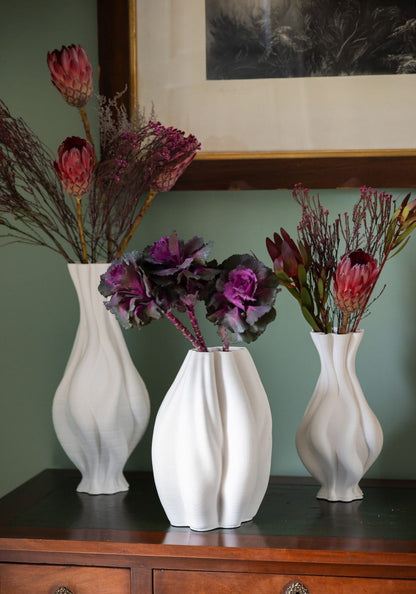 Tall white twisted ceramic vase from Casa by Josephine Jenno, elegant vase with a modern design and textured surface.