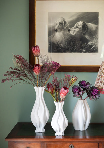 White twisted ceramic vase from Casa by Josephine Jenno, featuring an elegant, modern design perfect for home decor.