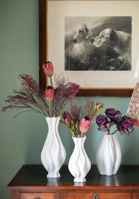 White twisted ceramic vase from Casa by Josephine Jenno, featuring an elegant, modern design perfect for home decor.