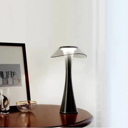 Hstrends Skyline rechargeable table lamp with modern design, featuring a sleek cylindrical shape and illuminated LED light.